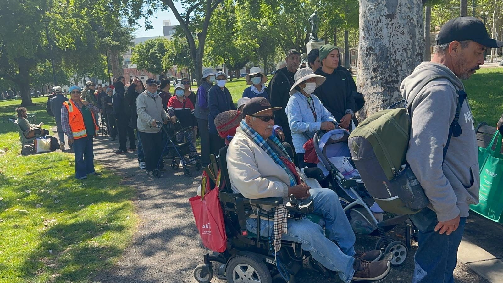People waiting in line along the path at St. James Park
