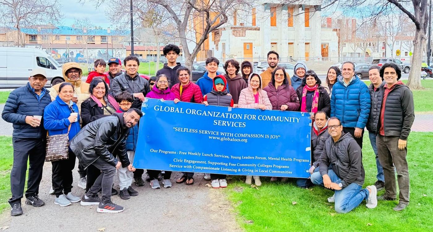 GOCS volunteers gathered behind the organization's banner at St. James Park