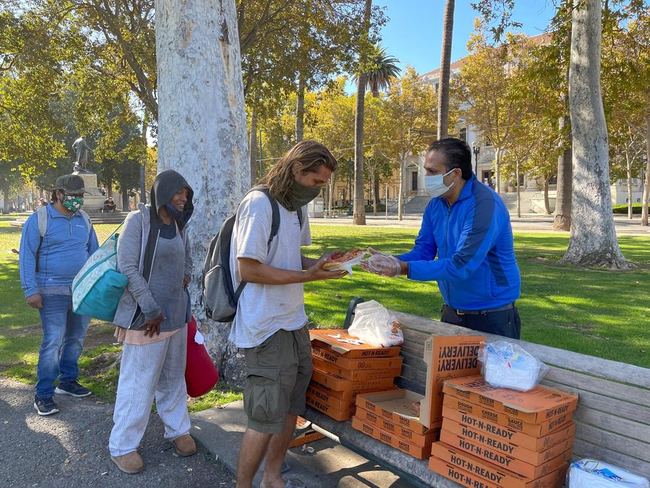 Volunteers serving food during the pandemic years